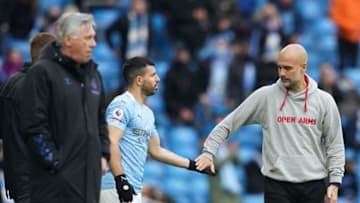 Sergio Aguero with Manchester City's manager Pep Guardiola playing his last league game before joining Barcelona this summer. (Photo by DAVE THOMPSON/POOL/AFP via Getty Images)
