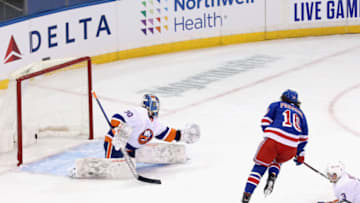 Jan 16, 2021; New York, New York, USA; New York Rangers left wing Artemi Panarin (10) scores a goal against New York Islanders goaltender Ilya Sorokin (30) during the first period at Madison Square Garden. Mandatory Credit: Bruce Bennett /POOL PHOTOS-USA TODAY Sports