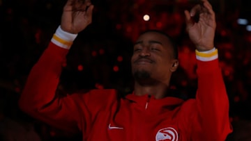 ATLANTA, GEORGIA - OCTOBER 21: John Collins #20 of the Atlanta Hawks reacts during player introductions prior to facing the Dallas Mavericks at State Farm Arena on October 21, 2021 in Atlanta, Georgia. NOTE TO USER: User expressly acknowledges and agrees that, by downloading and or using this photograph, User is consenting to the terms and conditions of the Getty Images License Agreement. (Photo by Kevin C. Cox/Getty Images)