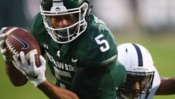 EAST LANSING, MI - NOVEMBER 04: Hunter Rison #5 of the Michigan State Spartans makes a second half catch while playing the Penn State Nittany Lions at Spartan Stadium on November 4, 2017 in East Lansing, Michigan. Michigan State won the game 27-24. (Photo by Gregory Shamus/Getty Images)