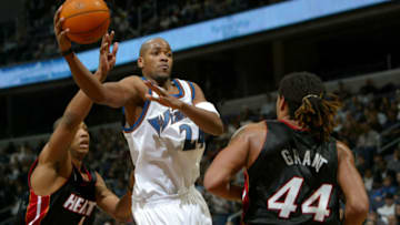 Jarvis Hayes #24 of the Washington Wizards passes the ball off in the face of the defense of Caron Butler #4 and Brian Grant #44 of the Miami Heat as the Heat defeated the Wizards 92-84 during NBA action (Photo by Doug Pensinger/Getty Images)