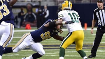 Aug 16, 2014; St. Louis, MO, USA; St. Louis Rams defensive end Michael Sam (96) sacks Green Bay Packers quarterback Matt Flynn (10) during the second half at Edward Jones Dome. Mandatory Credit: Scott Rovak-USA TODAY Sports