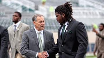 Oct 29, 2016; East Lansing, MI, USA; Michigan State Spartans head coach Mark Dantonio talks with Spartans wide receiver R.J. Shelton (12) before a game against the Michigan Wolverines at Spartan Stadium. Mandatory Credit: Mike Carter-USA TODAY Sports