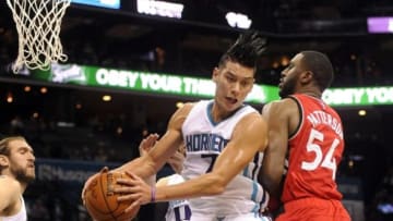 Dec 17, 2015; Charlotte, NC, USA; Charlotte Hornets guard Jeremy Lin (7) fights Toronto Raptors forward Patrick Patterson (54) for the rebound during the first half of the game at Time Warner Cable Arena. Mandatory Credit: Sam Sharpe-USA TODAY Sports