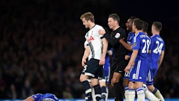 Tottenham Hotspur's Eric Dier is pulled away by referee Mark Clattenburg after fouling Chelsea's Eden Hazard (Photo by Darren Walsh/Chelsea FC via Getty Images)