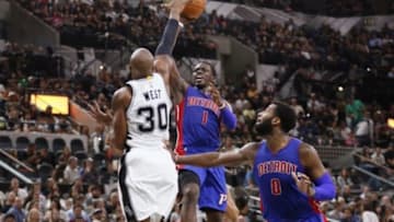 Oct 18, 2015; San Antonio, TX, USA; Detroit Pistons point guard Reggie Jackson (1) shoots the ball over San Antonio Spurs power forward David West (30) during the second half at AT&T Center. Mandatory Credit: Soobum Im-USA TODAY Sports