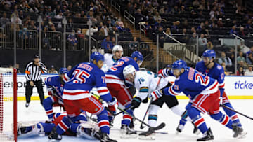 NEW YORK, NEW YORK - DECEMBER 03: Igor Shesterkin #31 of the New York Rangers is injured during this third period pileup against the San Jose Sharks at Madison Square Garden on December 03, 2021 in New York City. The Rangers shutout the Sharks 1-0. (Photo by Bruce Bennett/Getty Images)