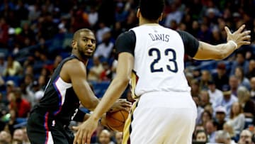 Dec 28, 2016; New Orleans, LA, USA; Los Angeles Clippers guard Chris Paul (3) is defended by New Orleans Pelicans forward Anthony Davis (23) during the first quarter of a game at the Smoothie King Center. Mandatory Credit: Derick E. Hingle-USA TODAY Sports