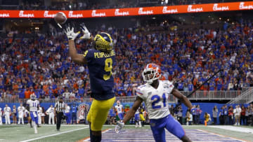 ATLANTA, GEORGIA - DECEMBER 29: Donovan Peoples-Jones #9 of the Michigan Wolverines scores a first quarter touchdown reception against Trey Dean III #21 of the Florida Gators during the Chick-fil-A Peach Bowl at Mercedes-Benz Stadium on December 29, 2018 in Atlanta, Georgia. (Photo by Mike Zarrilli/Getty Images)