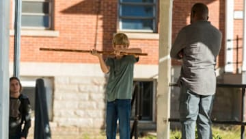 Lennie James as Morgan Jones, Macsen Lintz as Henry, Logan Miller as Benjamin - The Walking Dead _ Season 7, Episode 14 - Photo Credit: Gene Page/AMC