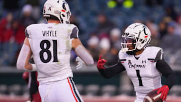 Cincinnati Bearcats wide receiver Tre Tucker celebrates with Josh Whyle after catching a touchdown against the Temple Owls. Getty Images.
