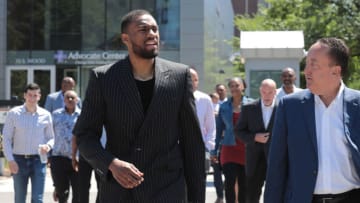 Newly signed Chicago Bulls player Jabari Parker walks toward the United Center with general manager Gar Forman on July 18, 2018 in Chicago. (Antonio Perez/ChicagoTribune/TNS via Getty Images)