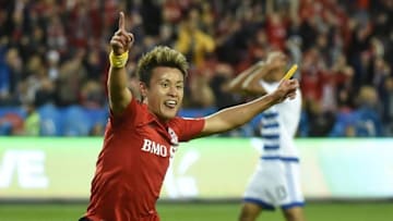 May 7, 2016; Toronto, Ontario, CAN; Toronto FC forward Tsubasa Endoh (9) celebrates scoring as FC Dallas midfielder Tesho Akindele reacts in the first half at BMO Field. Mandatory Credit: Dan Hamilton-USA TODAY Sports