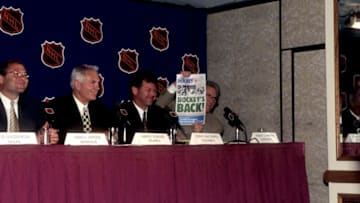 BUFFALO, NY - JUNE 25: Robert O. Naegele Jr. owner of the Minnesota Wild holds a newspaper that shows hockey will be back in Minnesota in the year 2000 as Craig L. Leipold, owner of the Nashville Predators, Harvey Schiller, owner of the Atlanta Thrashers and John P. McConnell, owner of the Columbus Blue Jackets look on during the NHL Expansion on June 25, 1997 in Buffalo, New York. (Photo by B Bennett/Bruce Bennett Studios/Getty Images)