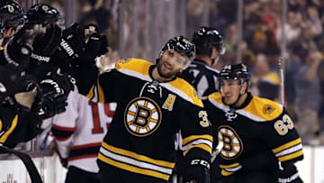 Oct 20, 2016; Boston, MA, USA; Boston Bruins center Patrice Bergeron (37) is followed by left wing Brad Marchand (63) after Bergeron scored the winning goal during the third period of the Boston Bruins 2-1 win over the New Jersey Devils at TD Garden. Mandatory Credit: Winslow Townson-USA TODAY Sports