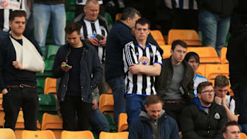 NORWICH, ENGLAND - APRIL 02: Frustrated Newcastle United supporters are seen on the stand after the Barclays Premier League match between Norwich City and Newcastle United at Carrow Road on April 2, 2016 in Norwich, England. (Photo by Stephen Pond/Getty Images)