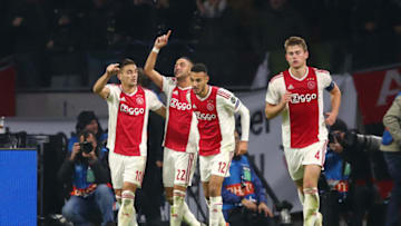 AMSTERDAM, NETHERLANDS - FEBRUARY 13: Hakim Ziyech of Ajax celebrates after scoring his team's first goal with his team mates during the UEFA Champions League Round of 16 First Leg match between Ajax and Real Madrid at Johan Cruyff Arena on February 13, 2019 in Amsterdam, Netherlands. (Photo by Lars Baron/Getty Images)