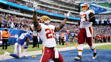 EAST RUTHERFORD, NJ - OCTOBER 28: Adrian Peterson #26 of the Washington Redskins celebrates his touchdown in the fourth quarter against the New York Giants with teammate Chase Roullier #73 on October 28,2018 at MetLife Stadium in East Rutherford, New Jersey. (Photo by Elsa/Getty Images)