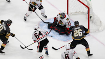 Corey Crawford #50 of the Chicago Blackhawks blocks a shot against the Vegas Golden Knights during the second period in Game One of the Western Conference First Round. (Photo by Jeff Vinnick/Getty Images)