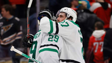 Dec 15, 2022; Washington, District of Columbia, USA; Dallas Stars goaltender Jake Oettinger (29) celebrates with Stars left wing Mason Marchment (27) after their game against the Washington Capitals at Capital One Arena. Mandatory Credit: Geoff Burke-USA TODAY Sports