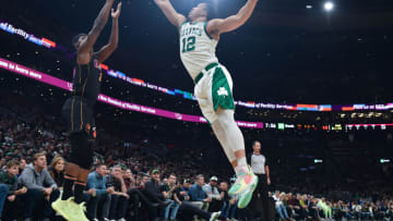Miami Heat forward Jimmy Butler (22) shoots the ball past Boston Celtics forward Grant Williams (12)(Bob DeChiara-USA TODAY Sports)