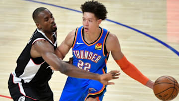 Jan 24, 2021; Los Angeles, California, USA; LA Clippers center Serge Ibaka (9) defends Oklahoma City Thunder forward Isaiah Roby (22) during the fourth quarter at Staples Center. Mandatory Credit: Robert Hanashiro-USA TODAY Sports