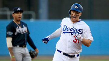 LOS ANGELES, CA - OCTOBER 04: Johan Camargo #17 of the Atlanta Braves looks on as Joc Pederson #31 of the Los Angeles Dodgers rounds the bases after his first inning home run during Game One of the National League Division Series at Dodger Stadium on October 4, 2018 in Los Angeles, California. (Photo by Sean M. Haffey/Getty Images)