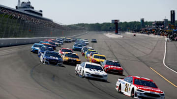 LONG POND, PA - JUNE 11: Ryan Blaney, driver of the #21 Motorcraft/Quick Lane Tire & Auto Center Ford, leads a pack of cars into turn one during the Monster Energy NASCAR Cup Series Axalta presents the Pocono 400 at Pocono Raceway on June 11, 2017 in Long Pond, Pennsylvania. (Photo by Jeff Zelevansky/Getty Images)