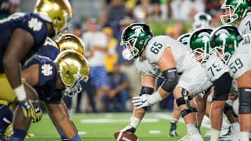 Sep 17, 2016; South Bend, IN, USA; Michigan State Spartans center Brian Allen (65) prepares to snap the ball in the second quarter against the Notre Dame Fighting Irish at Notre Dame Stadium. Mandatory Credit: Matt Cashore-USA TODAY Sports