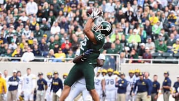 Oct 29, 2016; East Lansing, MI, USA; Michigan State Spartans wide receiver R.J. Shelton (12) makes a catch as Michigan Wolverines cornerback Jourdan Lewis (26) defends during the second half at Spartan Stadium. Mandatory Credit: Brad Mills-USA TODAY Sports