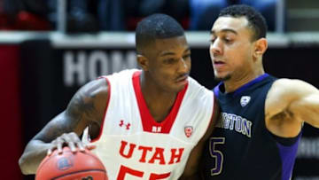Washington Huskies guard Nigel Williams-Goss (5) defends against Utah Utes guard Delon Wright (55) during the first half at Jon M. Huntsman Center. Mandatory Credit: Russ Isabella-USA TODAY Sports
