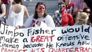 Oct 18, 2014; Tuscaloosa, AL, USA; Alabama Crimson Tide fans holds up a sign about Florida State issues at Bryant-Denny Stadium. Mandatory Credit: Marvin Gentry-USA TODAY Sports