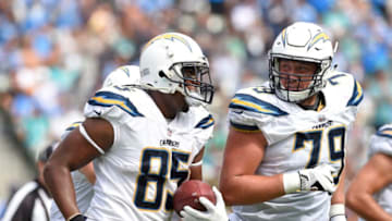 CARSON, CA - SEPTEMBER 17: Antonio Gates #85 of the Los Angeles Chargers celebrates with teammate Kenny Wiggins #79 after making the record all-time touchdowns by a tight end during the NFL game against Miami Dolphins at the StubHub Center September 17, 2017, in Carson, California. (Photo by Kevork Djansezian/Getty Images)