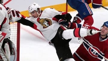 May 2, 2013; Montreal, Quebec, CAN; Montreal Canadiens left wing Brandon Prust (8) and Ottawa Senators defenseman Erik Karlsson (65) collide next to goalie Craig Anderson (41) during the third period in game one of the first round of the 2013 Stanley Cup playoffs at the Bell Centre. Mandatory Credit: Jean-Yves Ahern-USA TODAY Sports