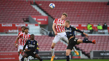 STOKE ON TRENT, ENGLAND - DECEMBER 05: Nathan Collins of Stoke City scores his sides first goal during the Sky Bet Championship match between Stoke City and Middlesbrough at Bet365 Stadium on December 05, 2020 in Stoke on Trent, England. The match will be played without fans, behind closed doors as a Covid-19 precaution. (Photo by Gareth Copley/Getty Images)