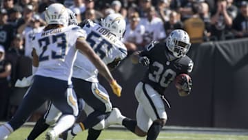 October 9, 2016; Oakland, CA, USA; Oakland Raiders running back Jalen Richard (30) runs the football against San Diego Chargers linebacker Korey Toomer (56) during the second quarter at Oakland Coliseum. Mandatory Credit: Kyle Terada-USA TODAY Sports