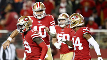 SANTA CLARA, CALIFORNIA - DECEMBER 21: Quarterback Jimmy Garoppolo #10 and wide receiver Deebo Samuel #19 of the San Francisco 49ers and teammates celebrate thier second quarter touchdown over the Los Angeles Rams during the game at Levi's Stadium on December 21, 2019 in Santa Clara, California. (Photo by Ezra Shaw/Getty Images)
