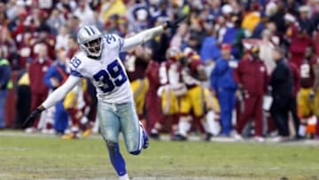 Dec 22, 2013; Landover, MD, USA; Dallas Cowboys cornerback Brandon Carr (39) celebrates in the final seconds of the fourth quarter against the Washington Redskins at FedEx Field. The Cowboys won 24-23. Mandatory Credit: Geoff Burke-USA TODAY Sports