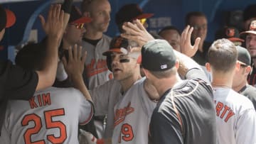 Jun 12, 2016; Toronto, Ontario, CAN; Baltimore Orioles first baseman Chris Davis (19) celebrates in the dug out after hitting a home run during the fifth inning in a game against the Toronto Blue Jays at Rogers Centre. Mandatory Credit: Nick Turchiaro-USA TODAY Sports