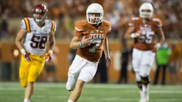 AUSTIN, TX - OCTOBER 15: Shane Buechele #7 of the Texas Longhorns scrambles for a first down against the Iowa State Cyclones during the second half on October 15, 2016 at Darrell K Royal-Texas Memorial Stadium in Austin, Texas. (Photo by Cooper Neill/Getty Images)