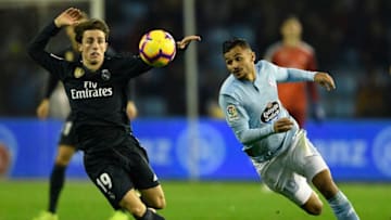 VIGO, SPAIN - NOVEMBER 11: Sofiane Boufal of Celta de Vigo competes for the ball with Alvaro Odriozola of Real Madrid during the La Liga match between RC Celta de Vigo and Real Madrid CF at Abanca-Balaidos on November 11, 2018 in Vigo, Spain. (Photo by Octavio Passos/Getty Images)