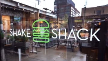 CHICAGO, ILLINOIS - MAY 06: A sign marks the entrance of a Shake Shack restaurant on May 06, 2022 in Chicago, Illinois. Despite beating analyst expectations with first-quarter earnings and revenues the company’s share price dropped as second-quarter guidance fell short of expectations. (Photo by Scott Olson/Getty Images)