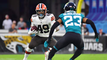 JACKSONVILLE, FLORIDA - AUGUST 14: C.J. Henderson #23 of the Jacksonville Jaguars looks to tackle John Kelly #49 of the Cleveland Browns in the second quarter during a preseason game at TIAA Bank Field on August 14, 2021 in Jacksonville, Florida. (Photo by Julio Aguilar/Getty Images)