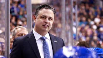 VANCOUVER, BC - APRIL 2: Head coach Travis Green of the Vancouver Canucks looks on from the bench during their NHL game against the San Jose Sharks at Rogers Arena April 2, 2019 in Vancouver, British Columbia, Canada. (Photo by Jeff Vinnick/NHLI via Getty Images)"n