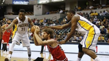 Oct 6, 2016; Indianapolis, IN, USA; Chicago Bulls center Robin Lopez (8) passes the ball in front of Indiana Pacers forward Kevin Seraphin (1) during the first half at Bankers Life Fieldhouse. Mandatory Credit: Brian Spurlock-USA TODAY Sports