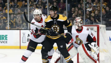 BOSTON, MA - APRIL 07: Ottawa Senators defenseman Cody Ceci (5) tries to move Boston Bruins center David Backes (42) from in front of Ottawa Senators goalie Danny Taylor (70) during a game between the Boston Bruins and the Ottawa Senators on April 7, 2018, at TD Garden in Boston, Massachusetts. The Bruins defeated the Senators 5-2. (Photo by Fred Kfoury III/Icon Sportswire via Getty Images)