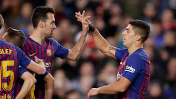 Barcelona's Sergio Busquets and Luis Suarez celebrate goal during the match against Sevilla. (Photo by Jeroen Meuwsen/Soccrates/Getty Images)