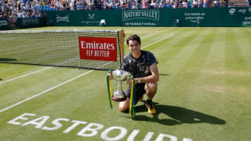 29th June 2019, Devonshire Park, Eastbourne, England; Nature Valley International Tennis Tournament; Taylor Fritz (USA) with his winners trophy after winning the mens singles final (photo by Hongbo Chen/Action Plus via Getty Images)