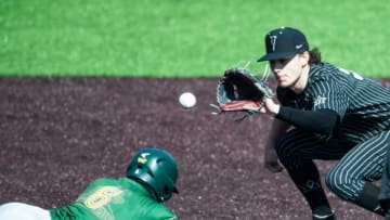 Wright State Raiders's Tyler Black (6) returns to second base as Vanderbilt Commodores's Carter Young (9) catches the ball against Wright State at Hawkins Field in Nashville, Tenn., Monday, Feb. 22, 2021.Vanderbilt Baseball 09