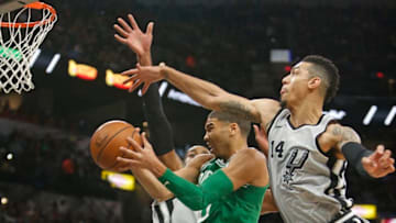 SAN ANTONIO,TX - DECEMBER 08: Jayson Tatum #0 of the Boston Celtics drives under Danny Green #14 of the San Antonio Spurs at AT&T Center on December 08, 2017 in San Antonio, Texas. NOTE TO USER: User expressly acknowledges and agrees that , by downloading and or using this photograph, User is consenting to the terms and conditions of the Getty Images License Agreement. (Photo by Ronald Cortes/Getty Images)